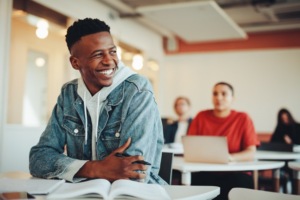 Highschooler grinning at the classmate sitting next to him